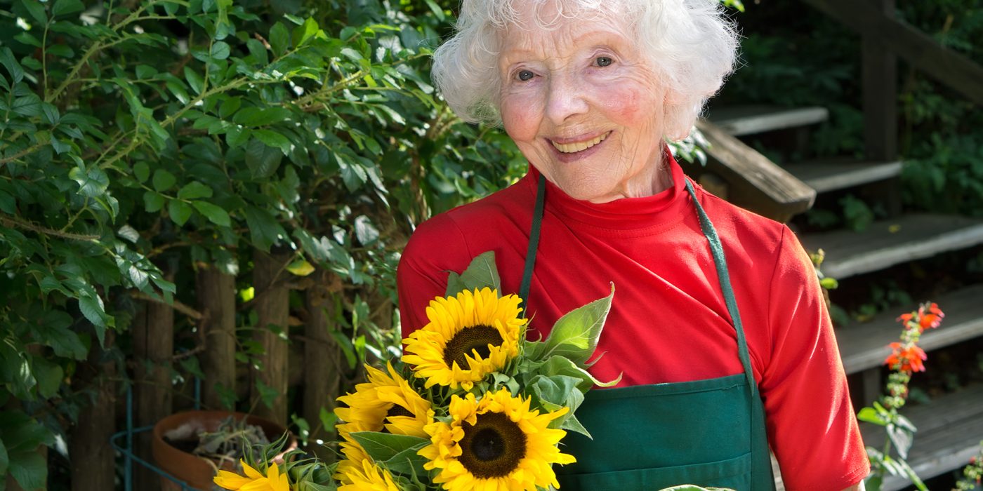 woman enjoying gardening and outdoor activities for seniors