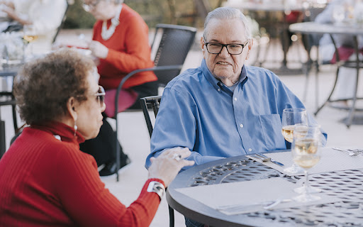 seniors outside having wine